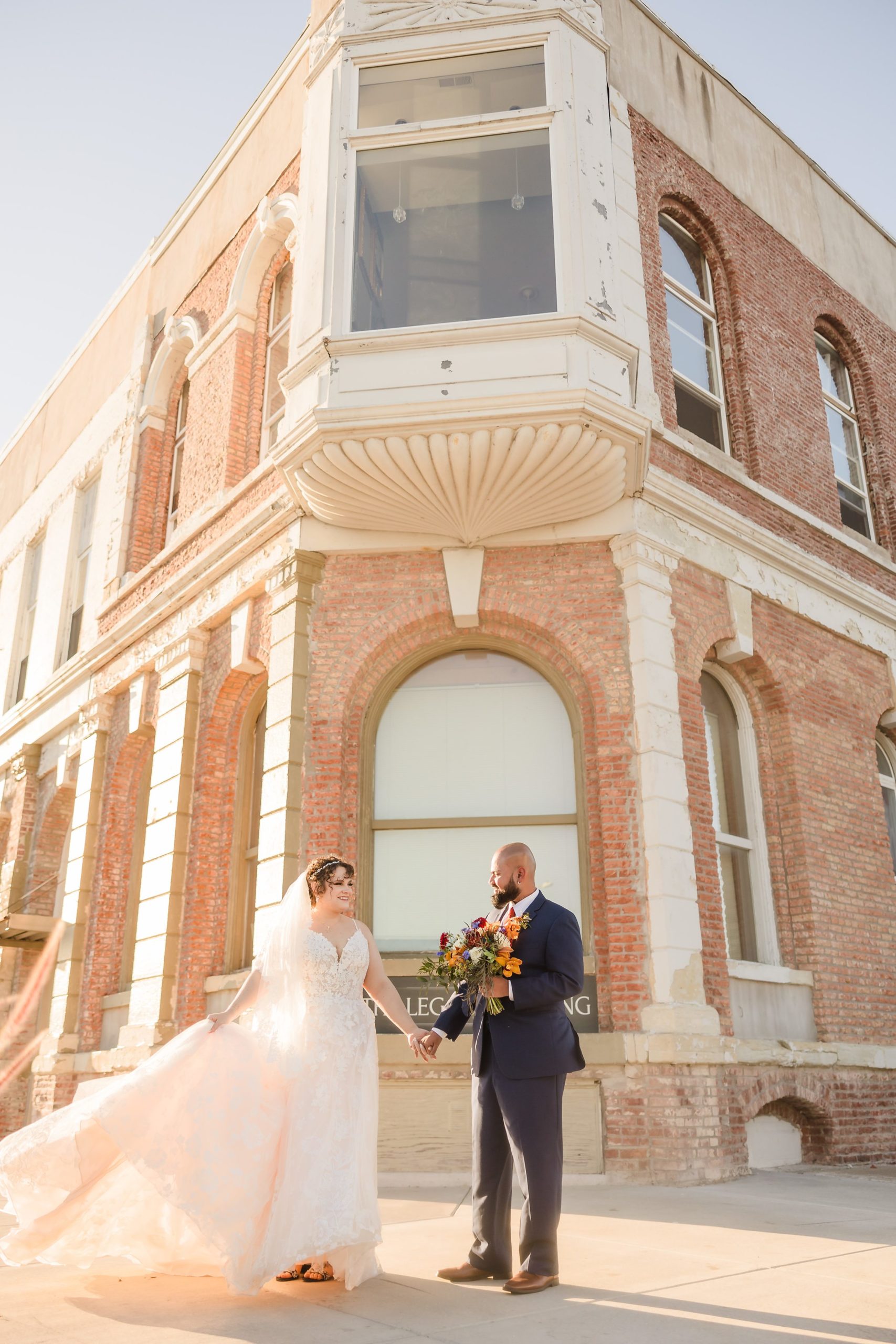 Bride and groom dance outside during their wedding at the Legacy Building in El Paso, Illinois.