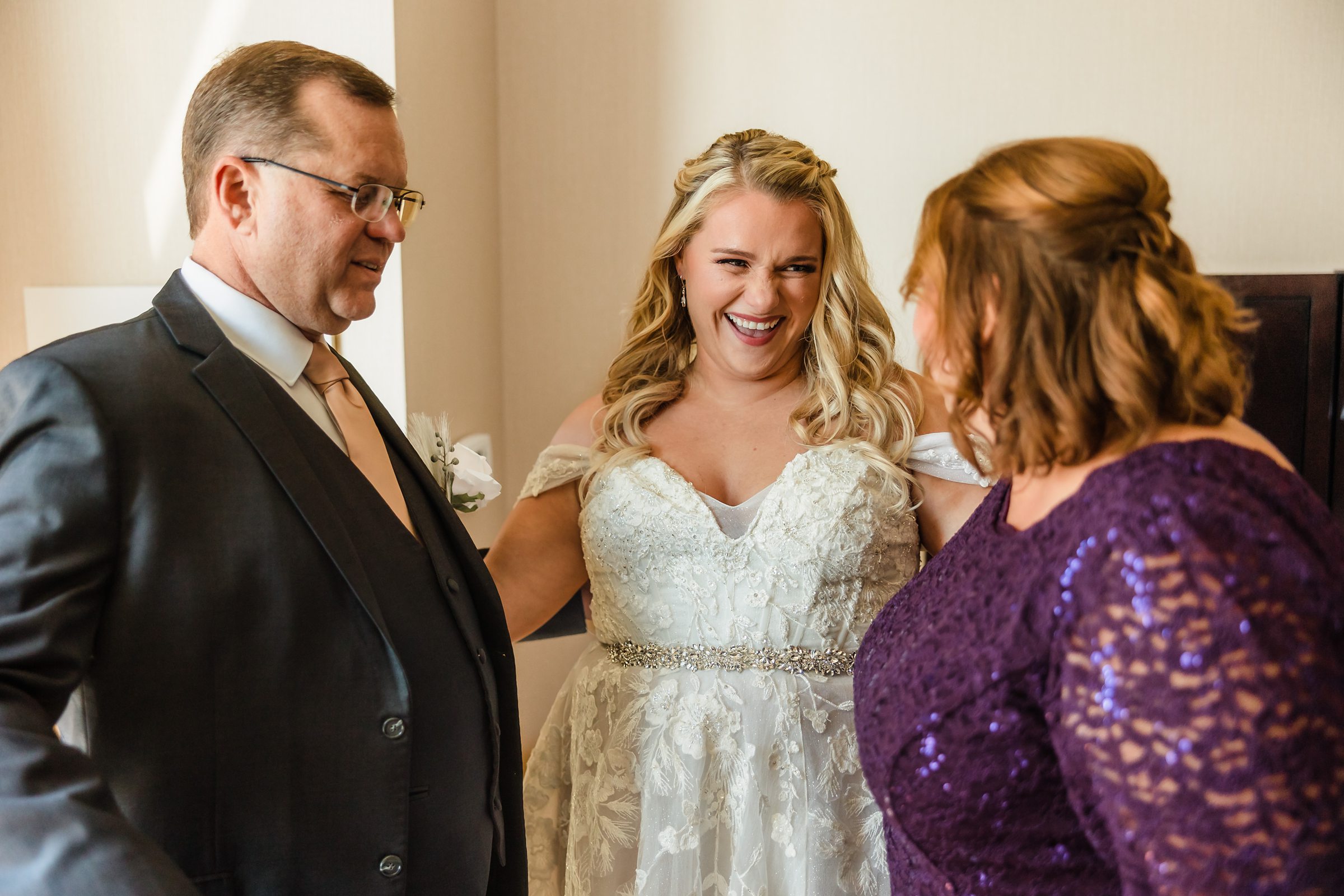 Bride celebrates with her family during her wedding at the Destihl Brewery in Normal, Illinois.