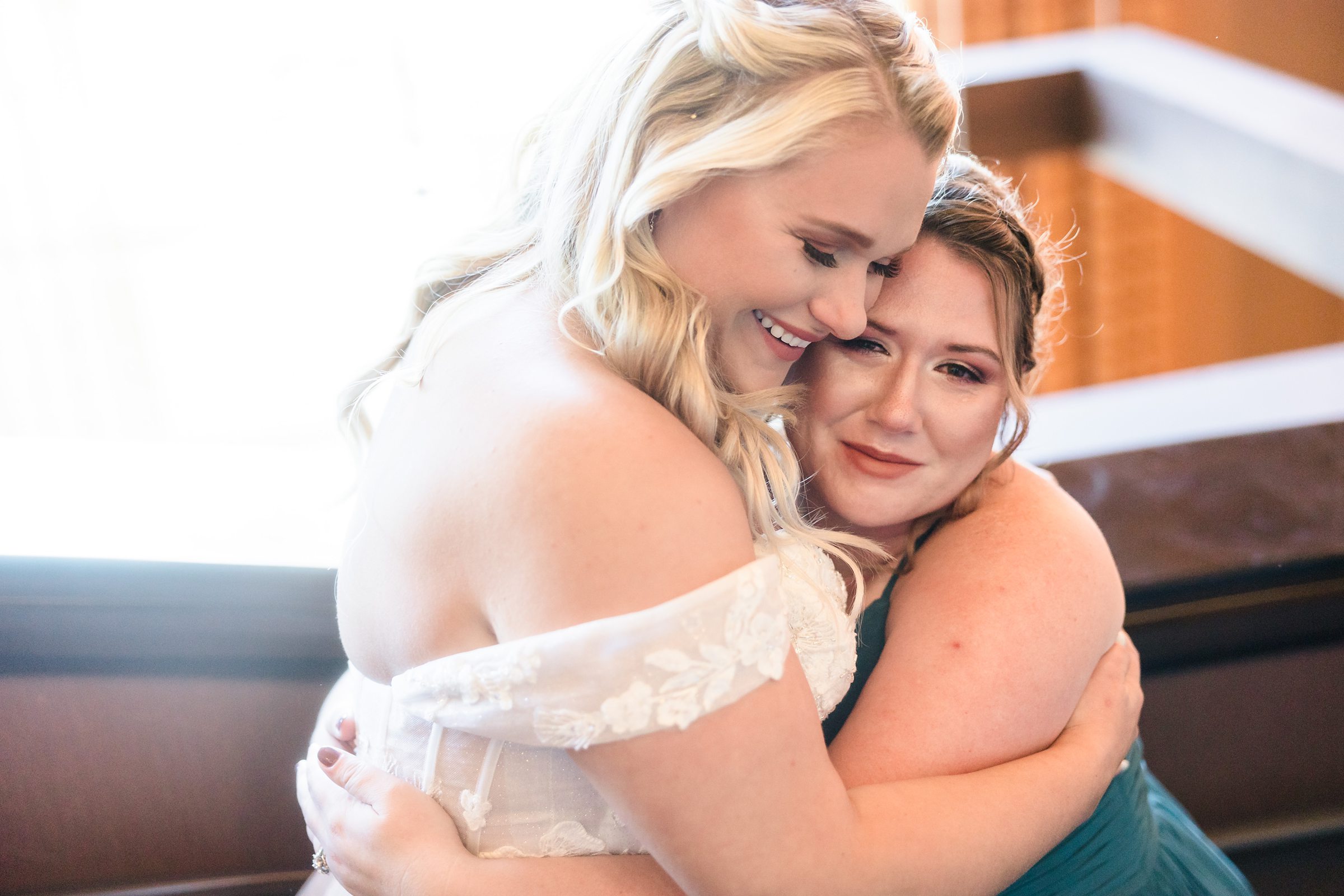 Bridesmaid gets emotional during a wedding at the Destihl Brewery in Normal, Illinois.