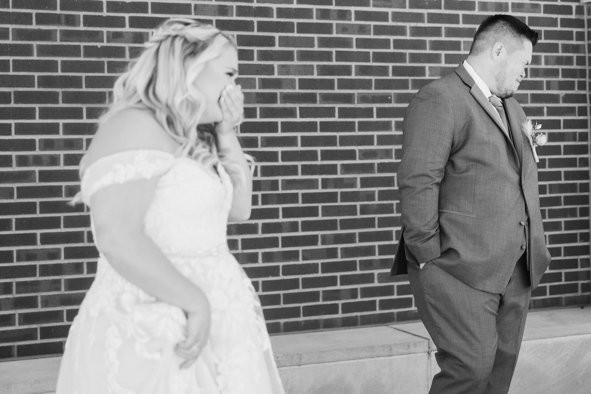 Bride and groom get emotional seeing eachother before their wedding at the Destihl Brewery in Normal, Illinois.