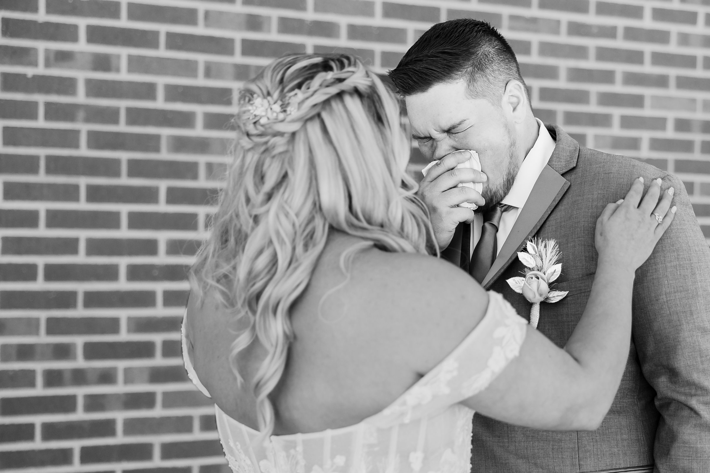 Groom gets emotional seeing his bride before his wedding at the Destihl Brewery in Normal, Illinois.
