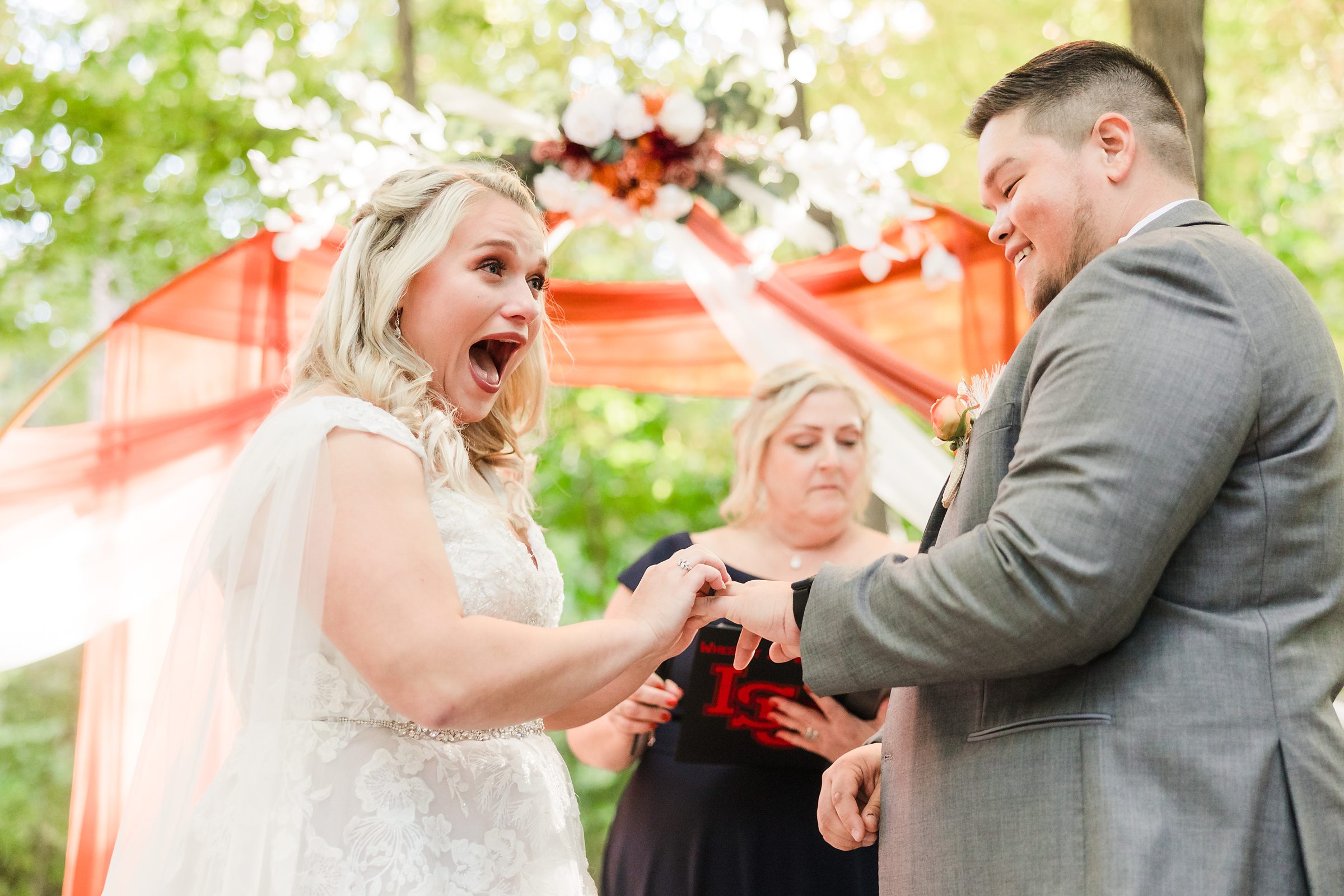 Bride is shocked during a wedding ceremony at Funks Grove in Mclean, Illinois.