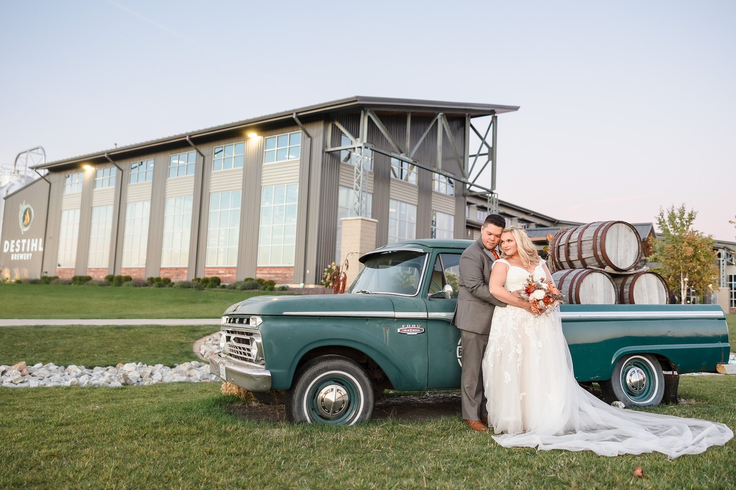 Bride and groom celebrate getting married during their wedding at the Destihl Brewery in Normal, Illinois.
