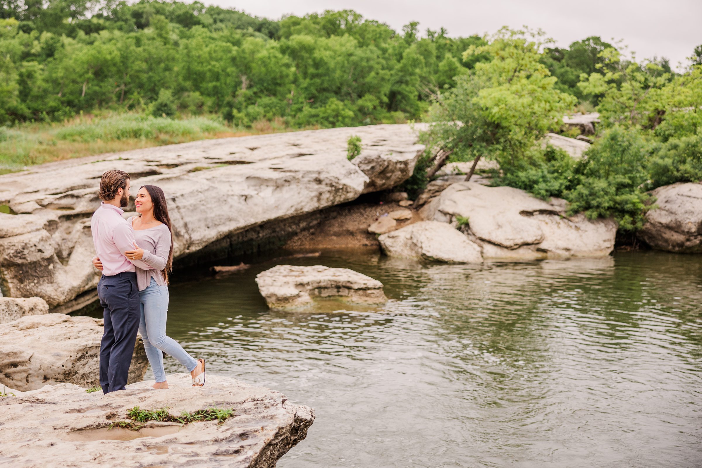 Austin Couple celebrate their engagement at Mckinney Falls State park in Austin, Texas. Photo taken by Austin Wedding Photographers, Joanna & Brett
