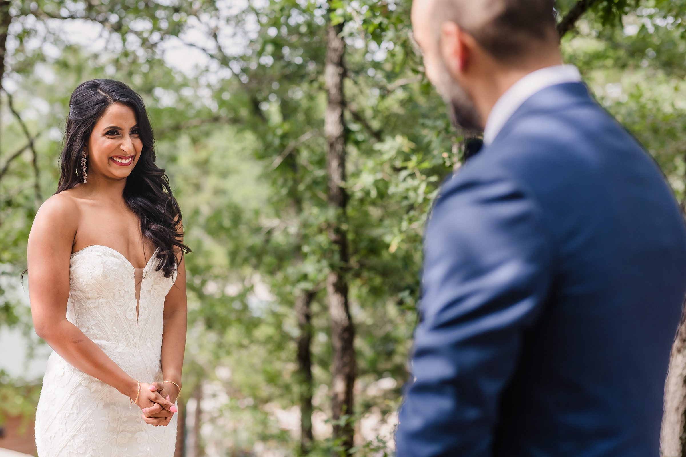 Bride sees the groom for the first time during a wedding at the Shiraz Garden in Bastrop, Texas.