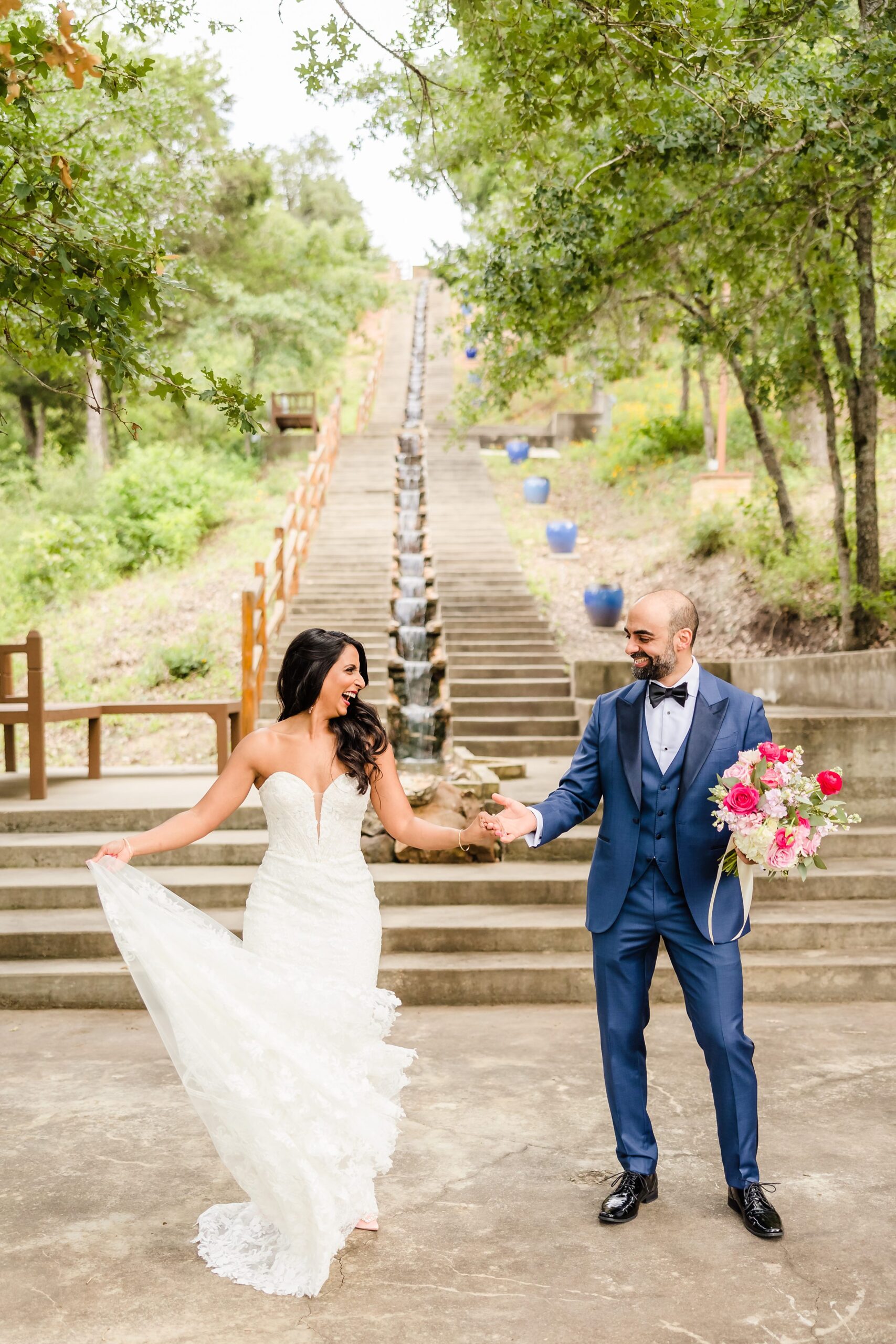 Bride and groom celebrate during a wedding at the Shiraz Garden in Bastrop, Texas.