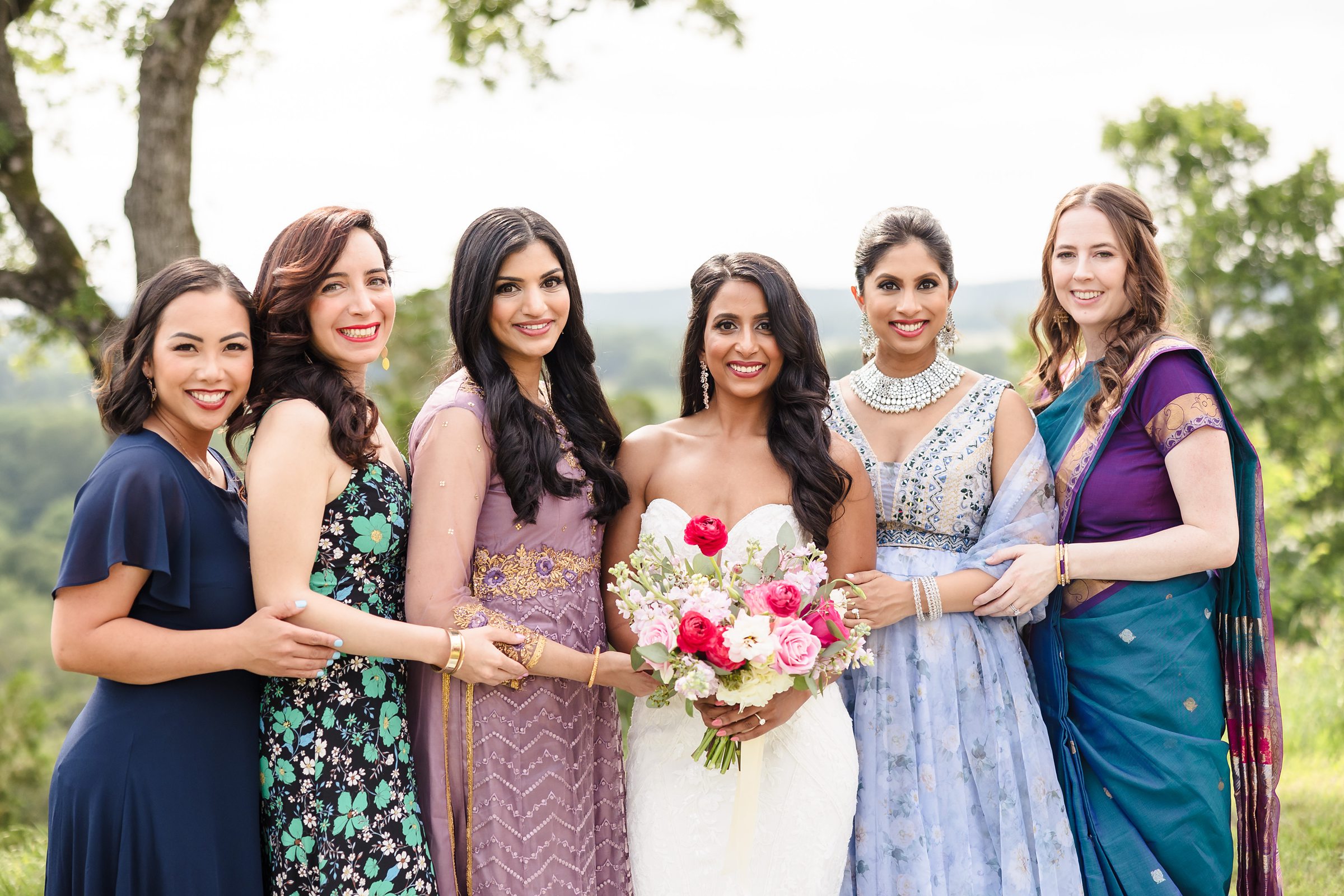 Bride and her bridesmaids during a wedding at Shiraz Garden in Bastrop, Texas.
