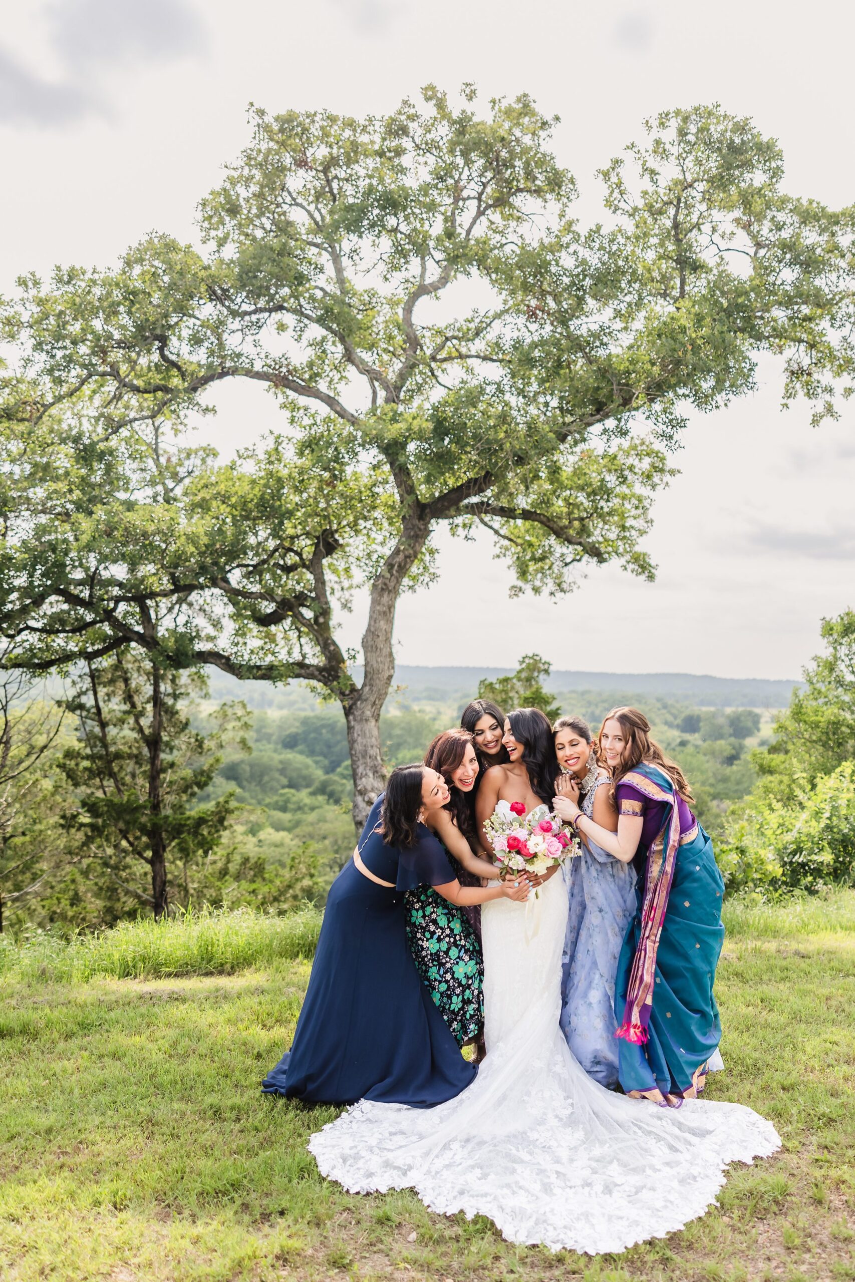 Bride and her bridesmaids during a wedding at Shiraz Garden in Bastrop, Texas.
