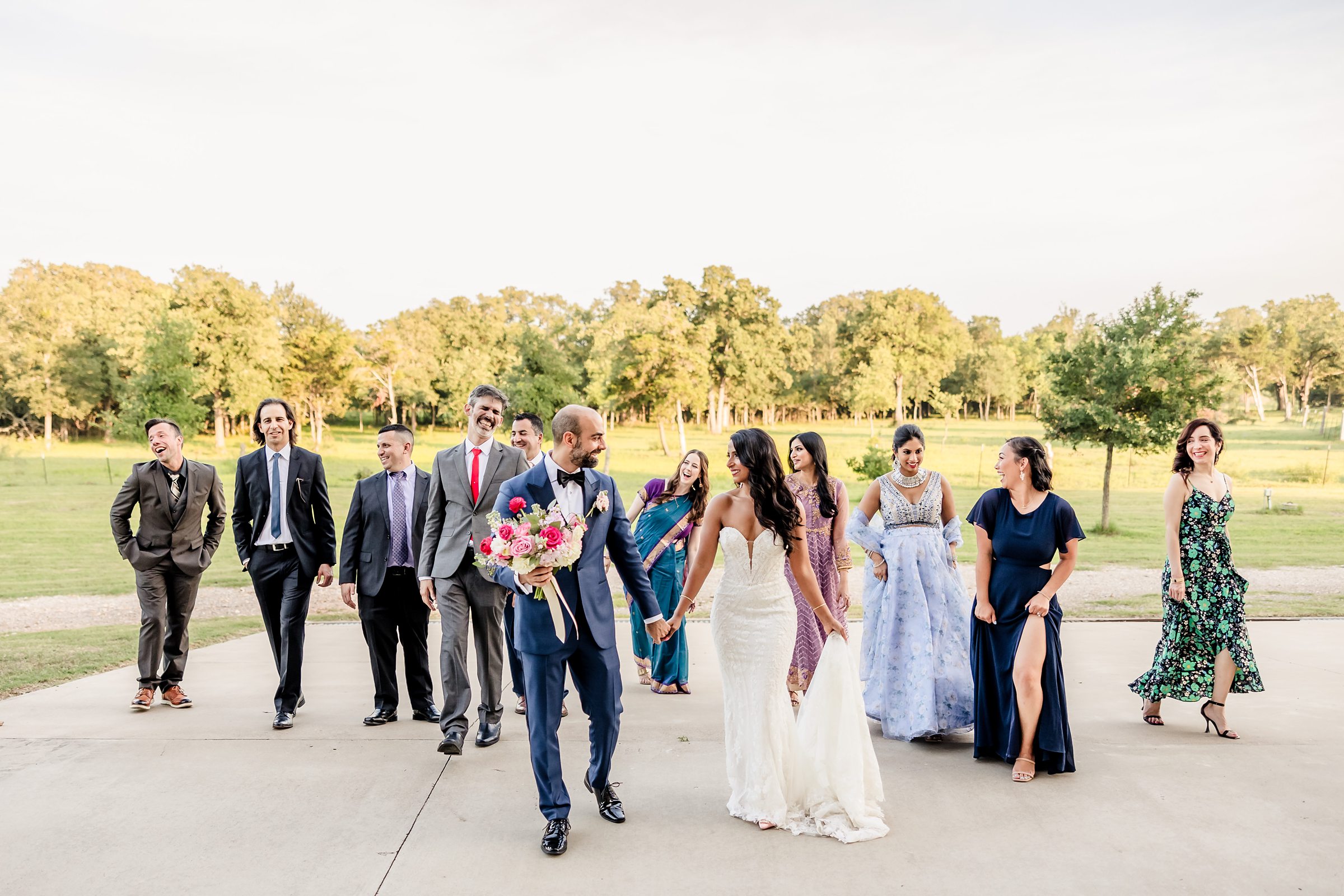 Bridal Party walk during a wedding at Shiraz Garden in Bastrop, Texas.