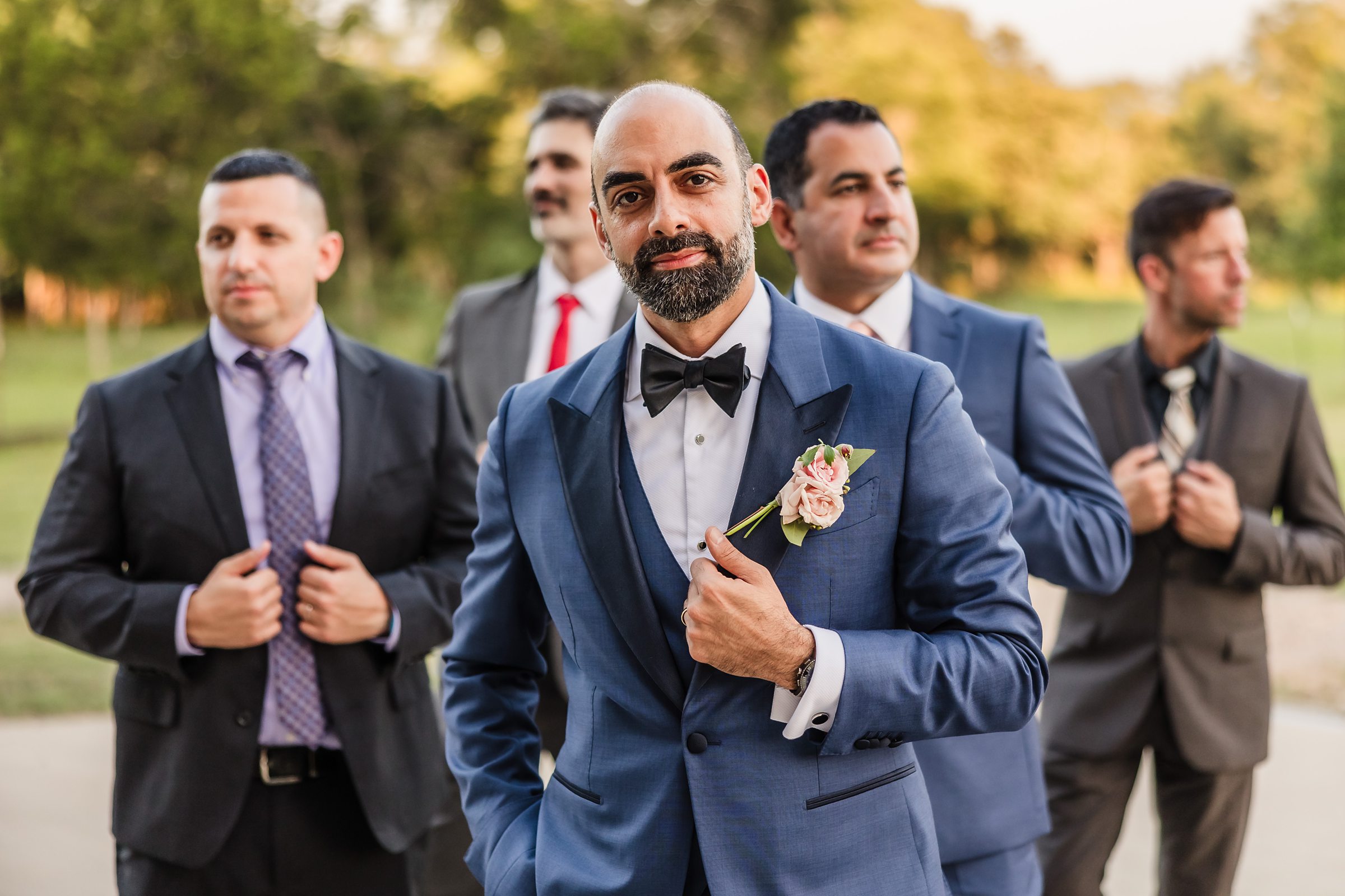 Groom and groomsmen during a wedding at Shiraz Garden in Bastrop, Texas.