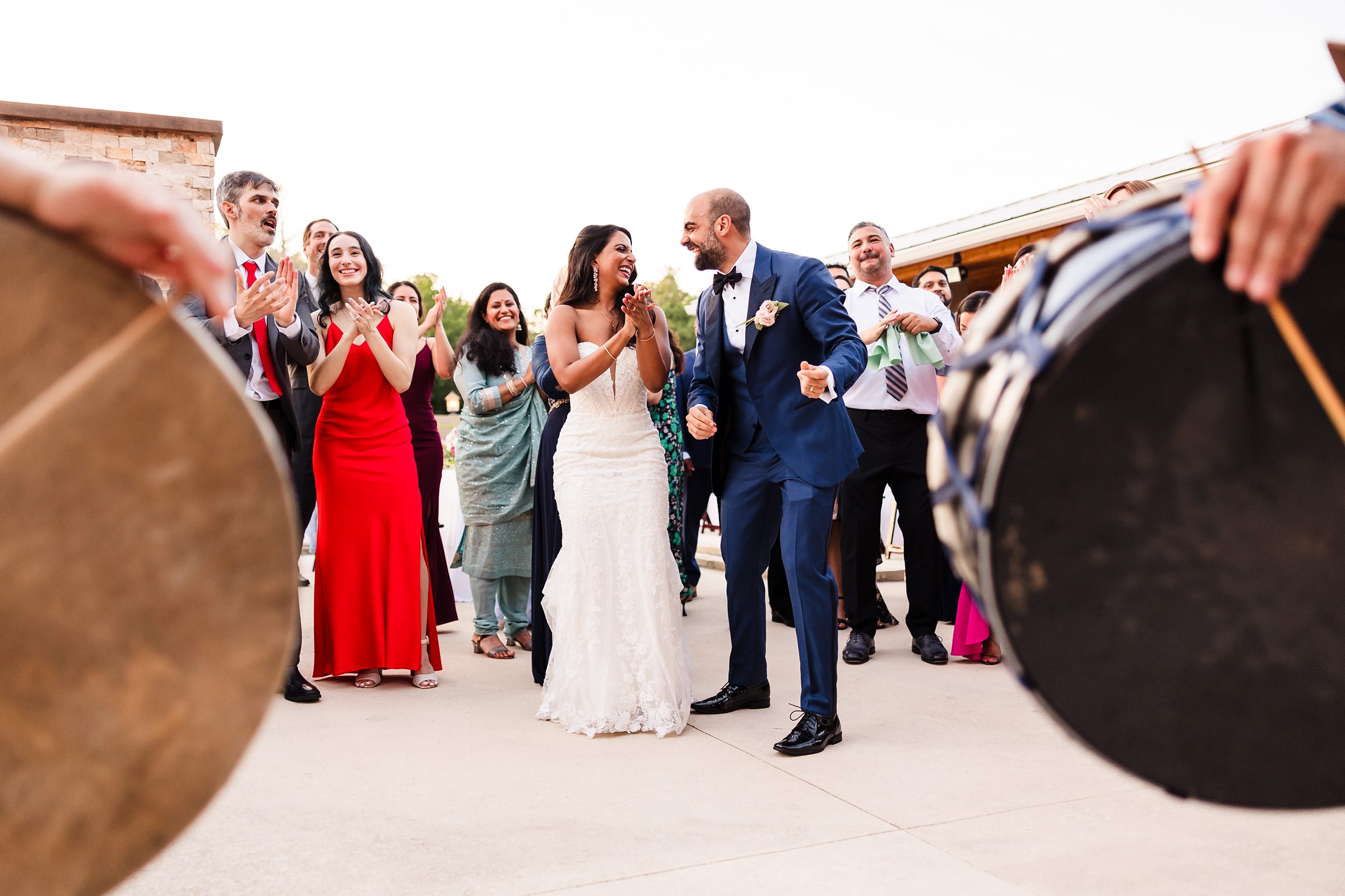 Bride and groom celebrate during a wedding at Shiraz Garden in Bastrop, Texas.