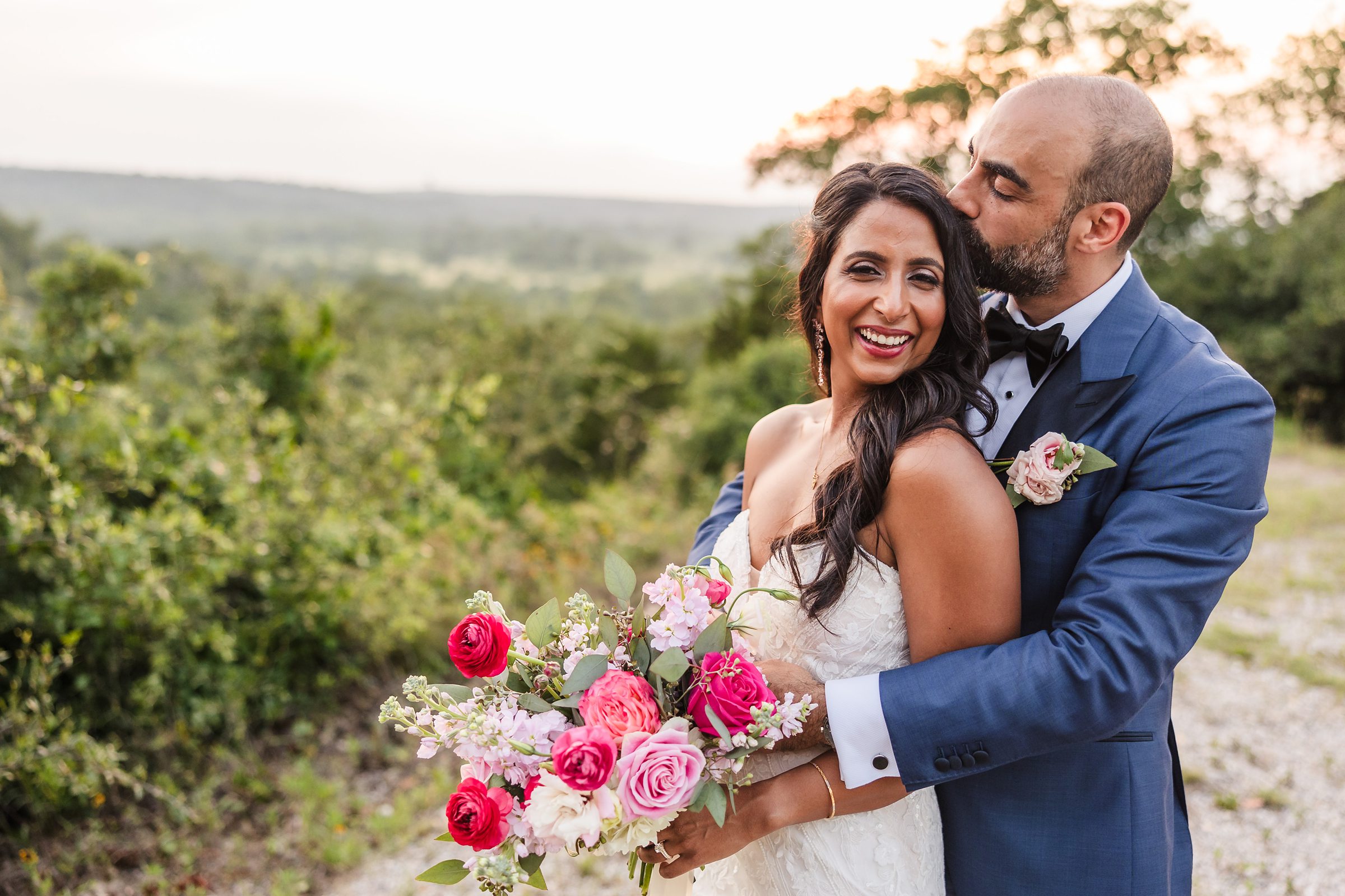 Bride and groom celebrate during a wedding at the Shiraz Garden in Bastrop, Texas.